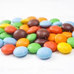 Colored sugar coated with chocolate